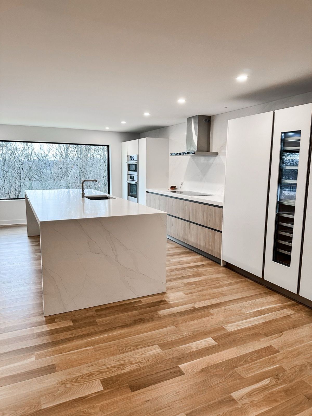 A kitchen remodel by Housewright with new white oak floors